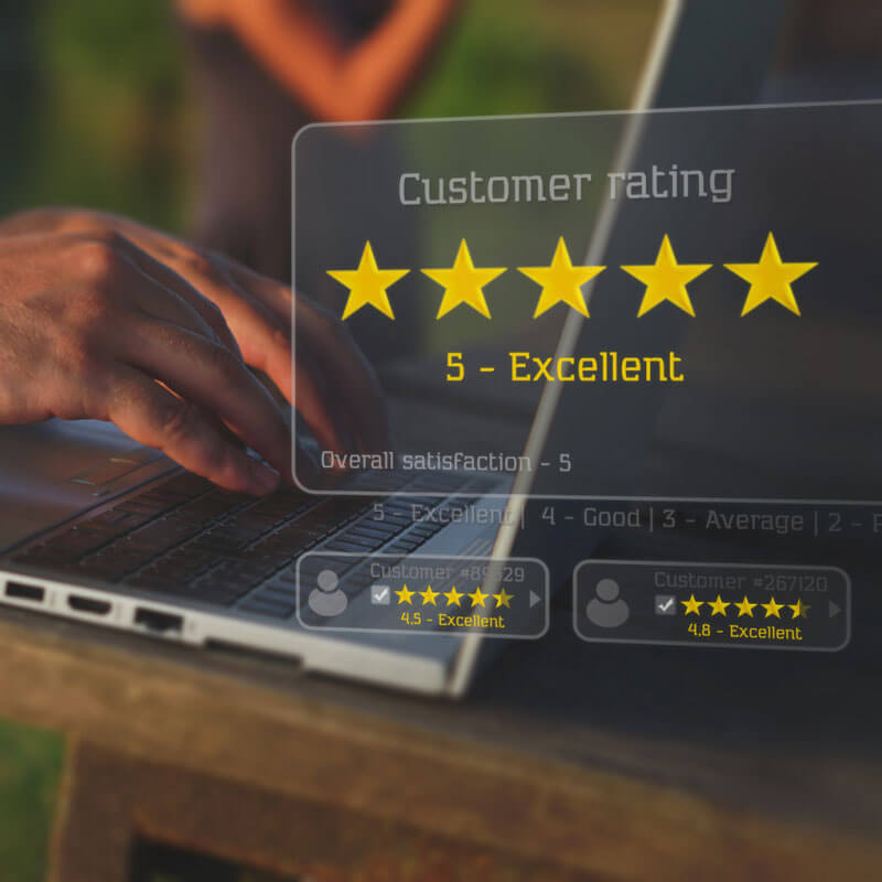 person on laptop typing with a 5-star review customer rating overlay