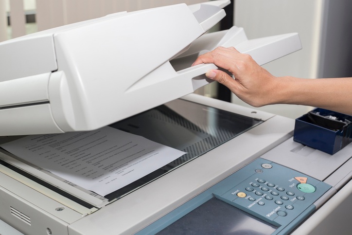 Worker scanning documents for secure storage in Dallas-Fort Worth